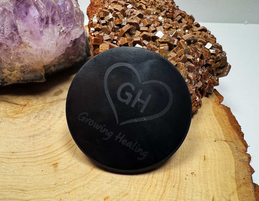 XL Shungite phone tab with Growing Healing logo on wooden surface with crystals